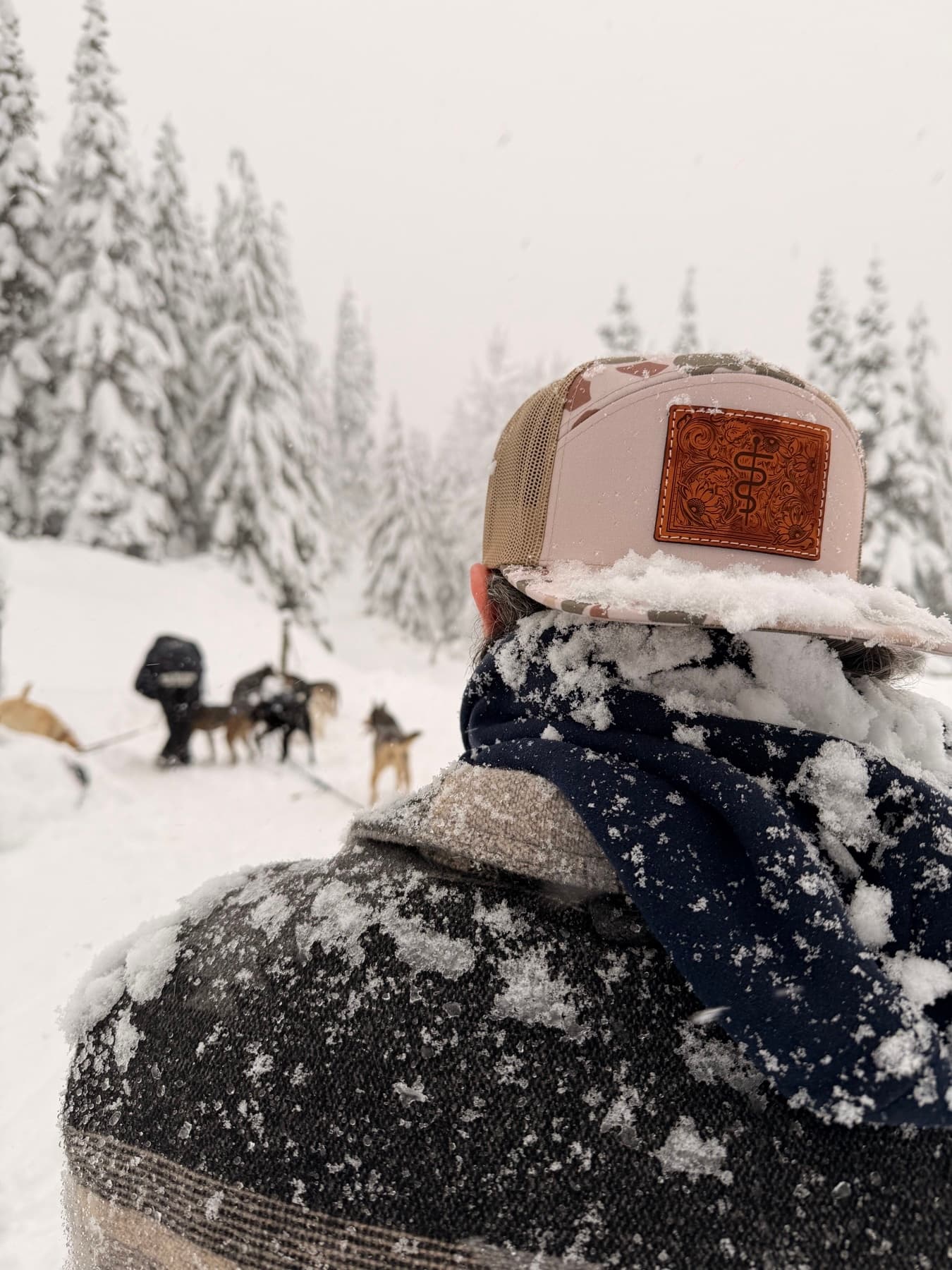 Leather patch flat brim hat in the snow